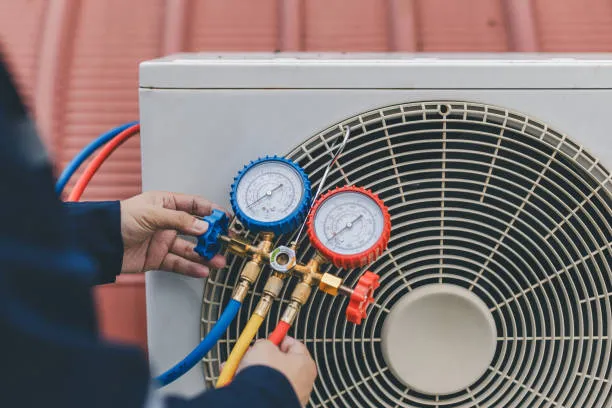 HVAC technician servicing a unit in Cheverly, Maryland. Professional heating system check with gauges, ensuring optimal performance and efficiency.