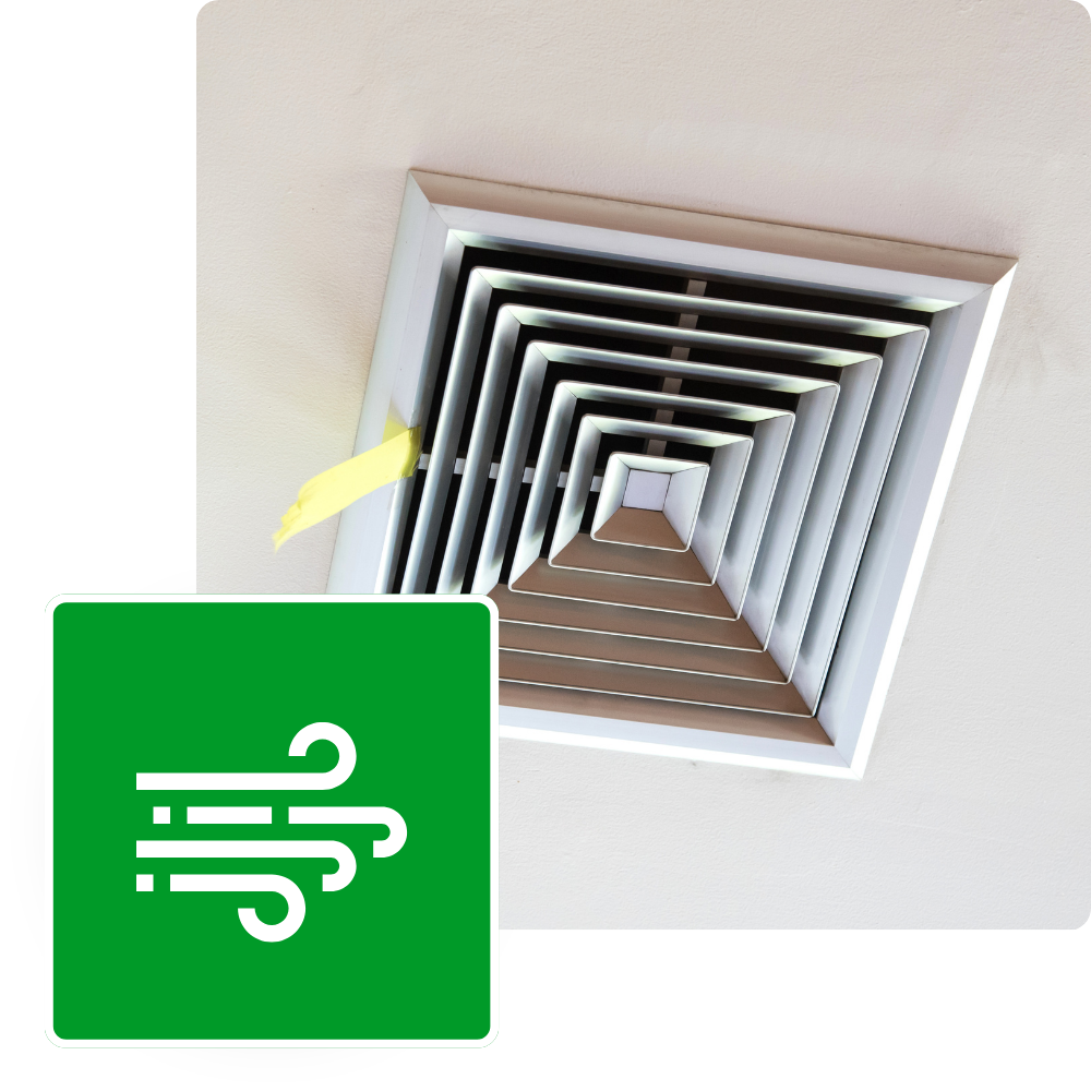 Home air vent on ceiling with a green 'air flow' icon overlay. Clean air and ventilation system services for a healthy home environment.